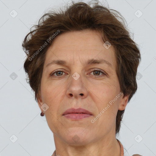 Joyful white adult female with short  brown hair and brown eyes