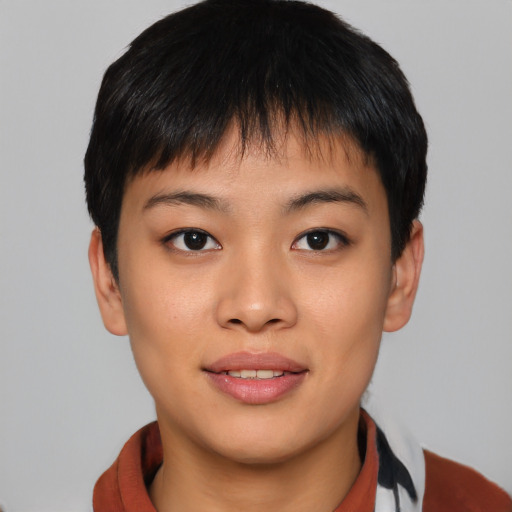 Joyful asian young-adult female with short  black hair and brown eyes