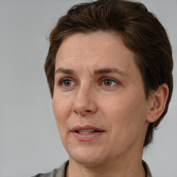 Joyful white adult female with short  brown hair and brown eyes