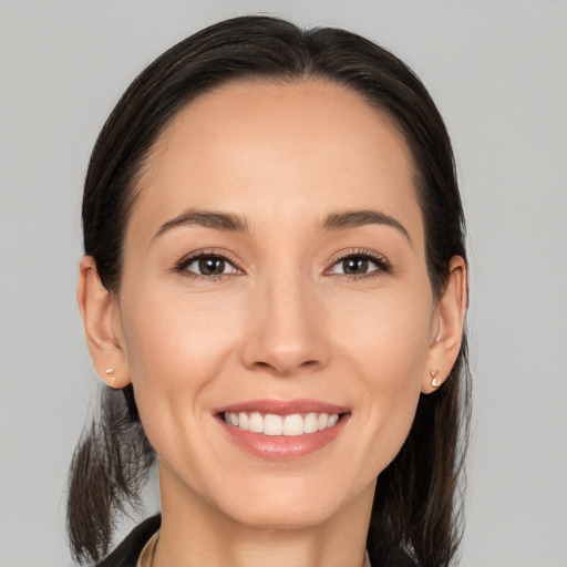 Joyful white young-adult female with medium  brown hair and brown eyes