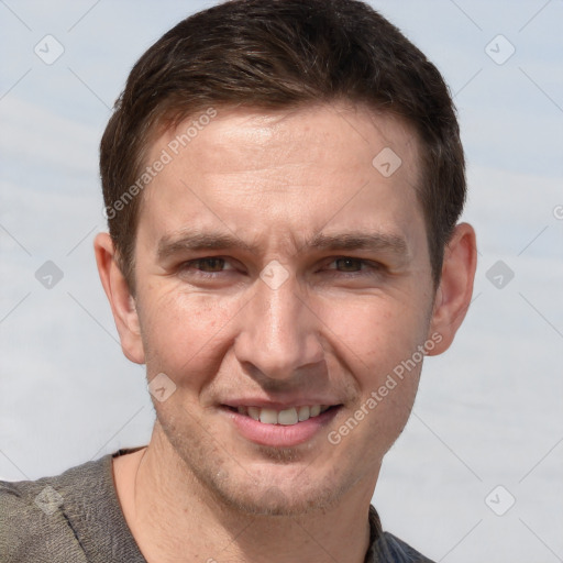 Joyful white adult male with short  brown hair and grey eyes