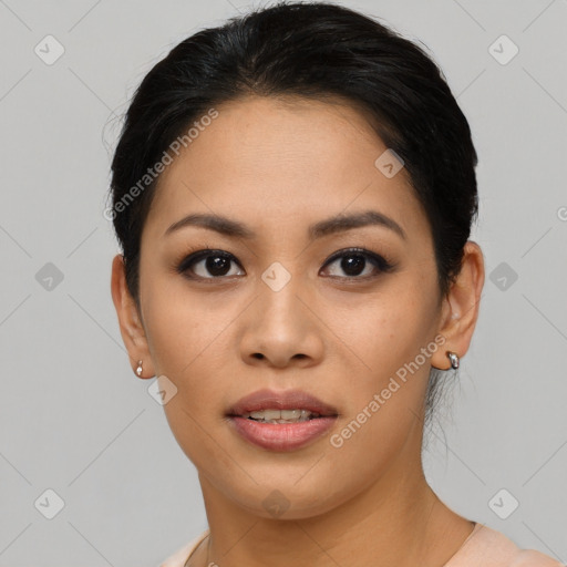 Joyful asian young-adult female with short  black hair and brown eyes