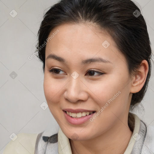 Joyful asian young-adult female with medium  brown hair and brown eyes