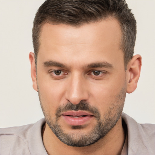 Joyful white young-adult male with short  brown hair and brown eyes