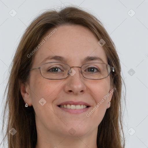 Joyful white adult female with long  brown hair and grey eyes