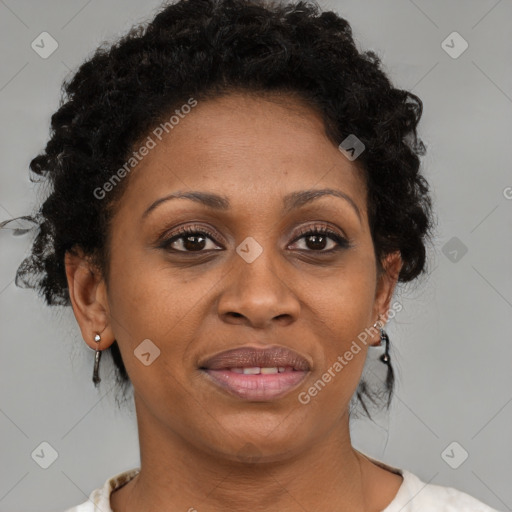 Joyful black adult female with short  brown hair and brown eyes