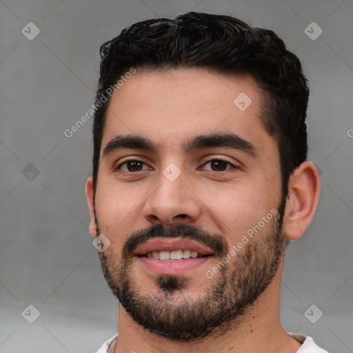 Joyful white young-adult male with short  black hair and brown eyes