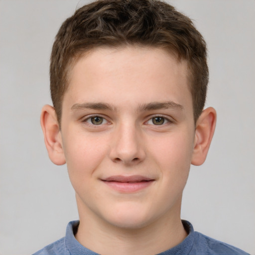 Joyful white child male with short  brown hair and brown eyes