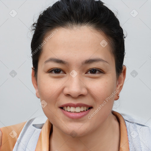 Joyful asian young-adult female with short  brown hair and brown eyes