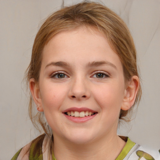 Joyful white child female with medium  brown hair and grey eyes