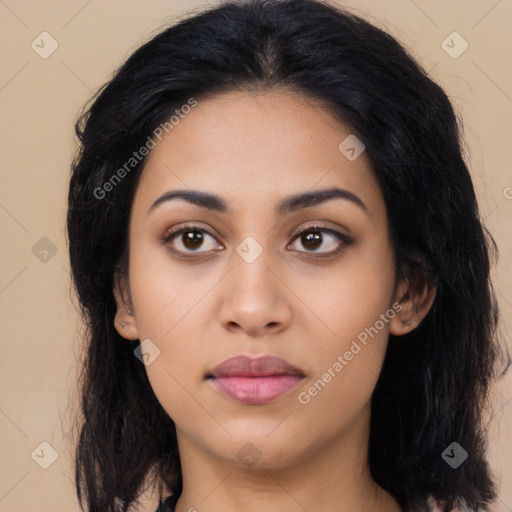 Joyful latino young-adult female with long  black hair and brown eyes