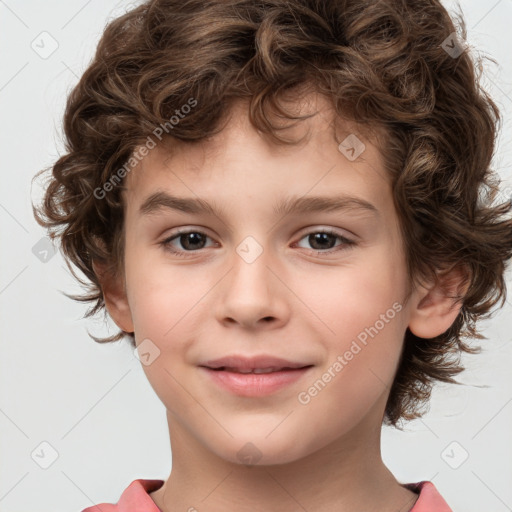 Joyful white child male with medium  brown hair and brown eyes