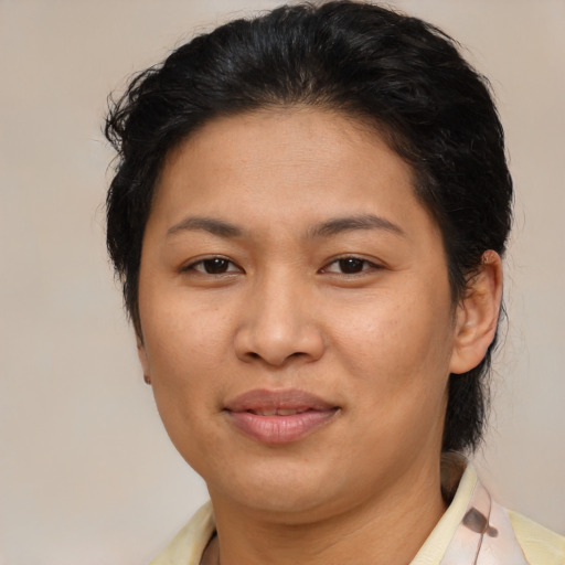 Joyful asian young-adult female with medium  brown hair and brown eyes