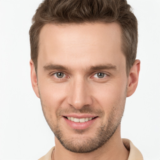 Joyful white young-adult male with short  brown hair and brown eyes