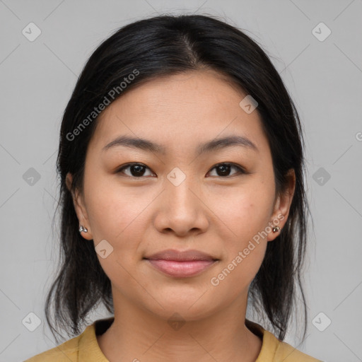 Joyful latino young-adult female with medium  brown hair and brown eyes