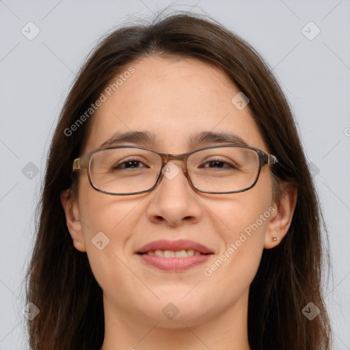 Joyful white adult female with long  brown hair and brown eyes