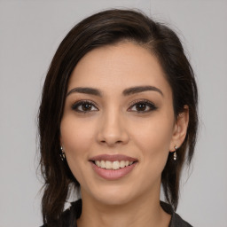 Joyful white young-adult female with medium  brown hair and brown eyes