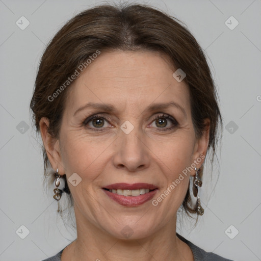 Joyful white adult female with medium  brown hair and grey eyes