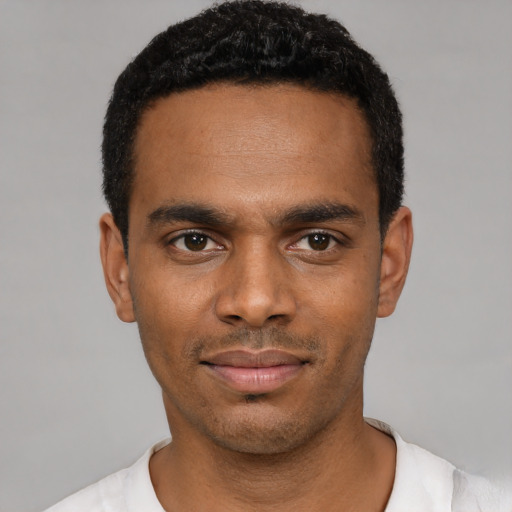 Neutral black young-adult male with short  black hair and brown eyes