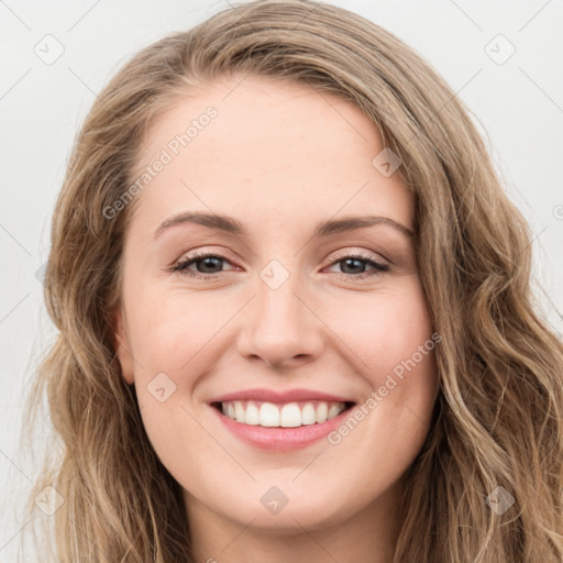 Joyful white young-adult female with long  brown hair and green eyes