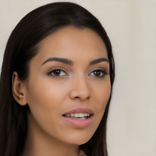 Joyful latino young-adult female with long  brown hair and brown eyes