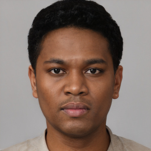 Neutral black young-adult male with short  black hair and brown eyes