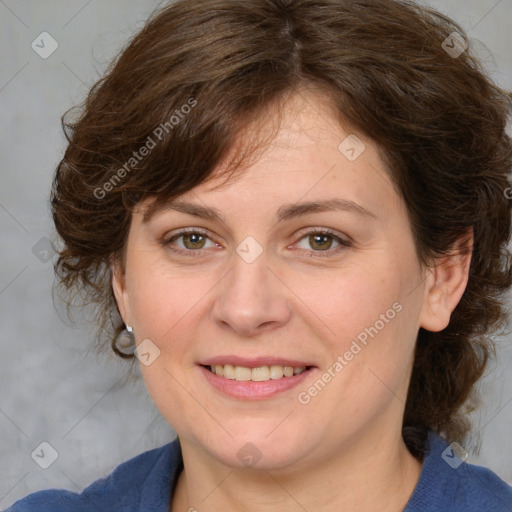 Joyful white adult female with medium  brown hair and blue eyes