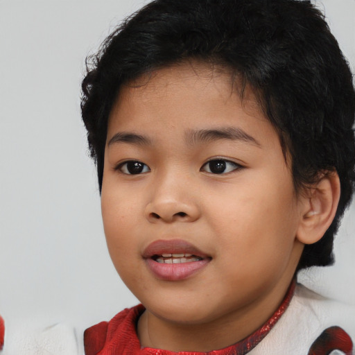 Joyful asian child female with short  brown hair and brown eyes