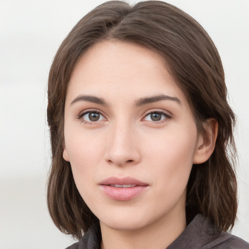 Neutral white young-adult female with medium  brown hair and grey eyes