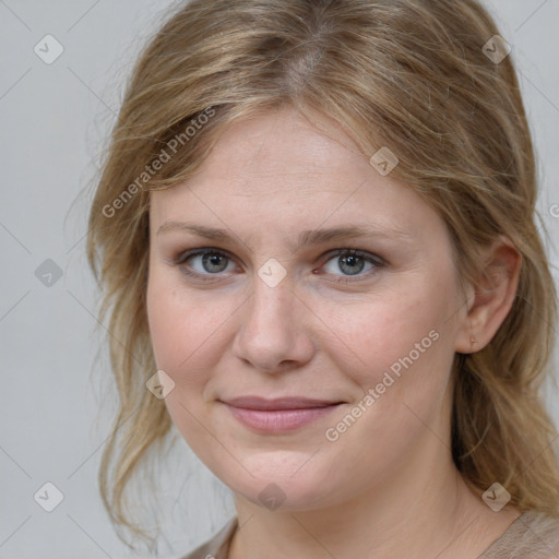 Joyful white young-adult female with medium  brown hair and blue eyes