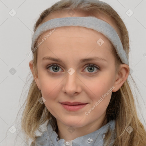 Joyful white young-adult female with long  brown hair and blue eyes