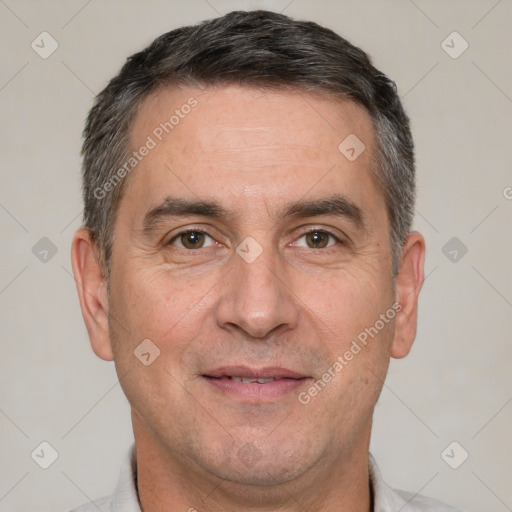 Joyful white adult male with short  brown hair and brown eyes