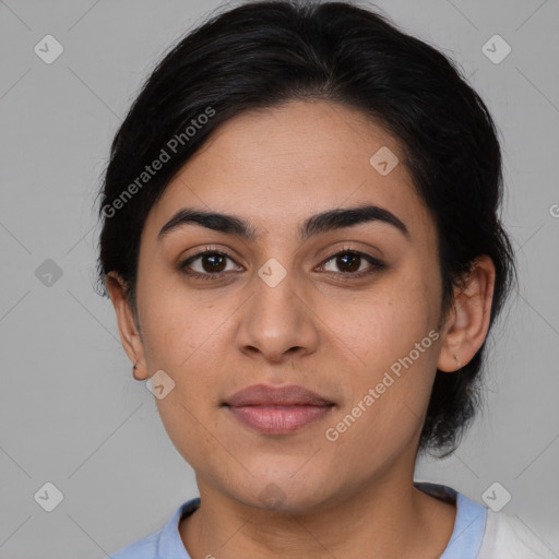 Joyful latino young-adult female with medium  brown hair and brown eyes