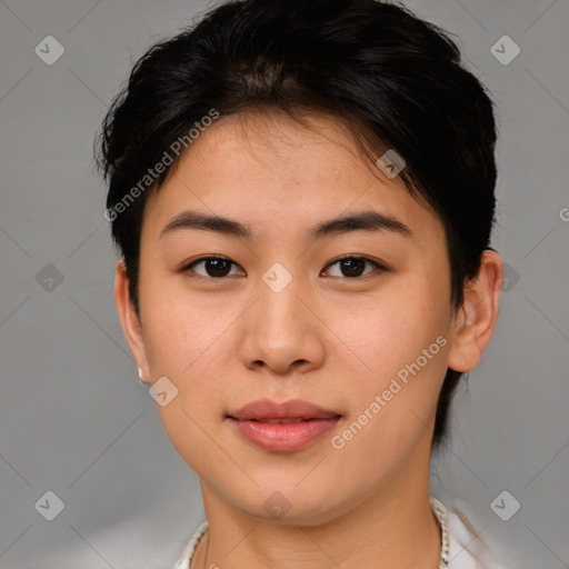 Joyful asian young-adult female with short  brown hair and brown eyes