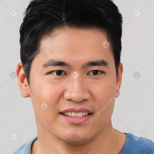 Joyful asian young-adult male with short  brown hair and brown eyes