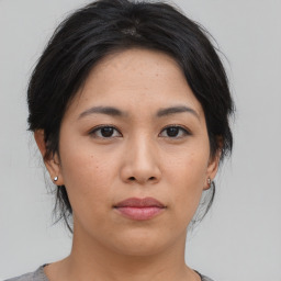 Neutral asian young-adult female with medium  brown hair and brown eyes