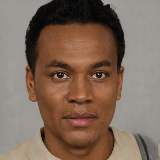 Neutral black young-adult male with short  black hair and brown eyes