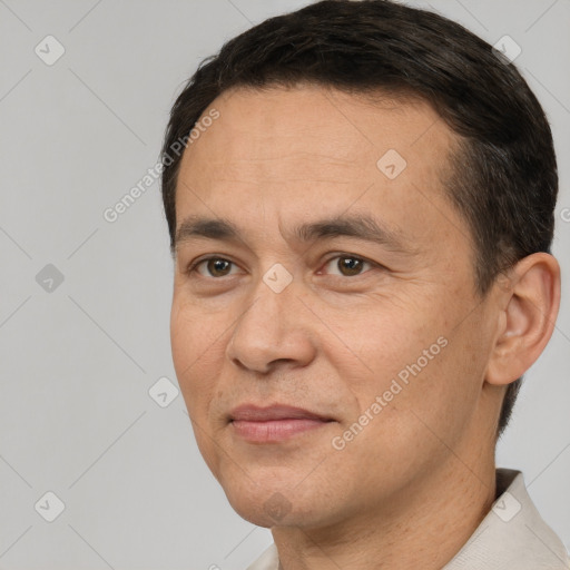 Joyful white adult male with short  brown hair and brown eyes