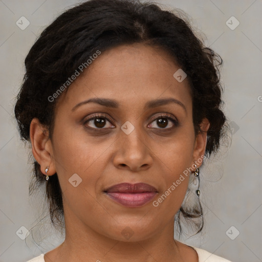 Joyful black adult female with medium  brown hair and brown eyes