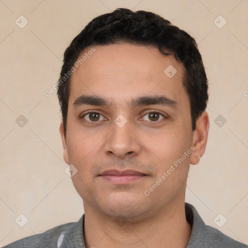 Neutral white young-adult male with short  black hair and brown eyes