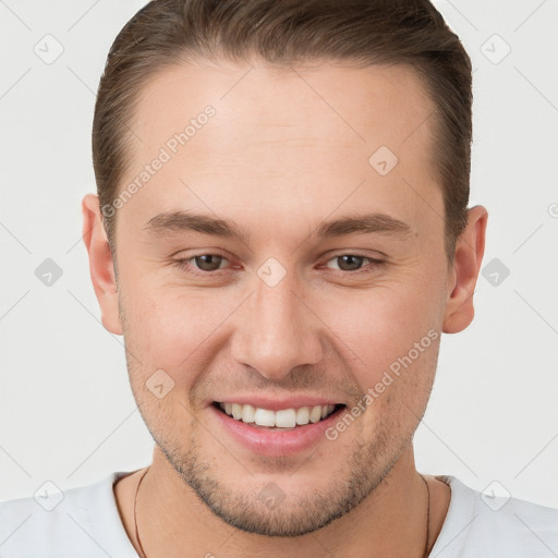 Joyful white young-adult male with short  brown hair and brown eyes