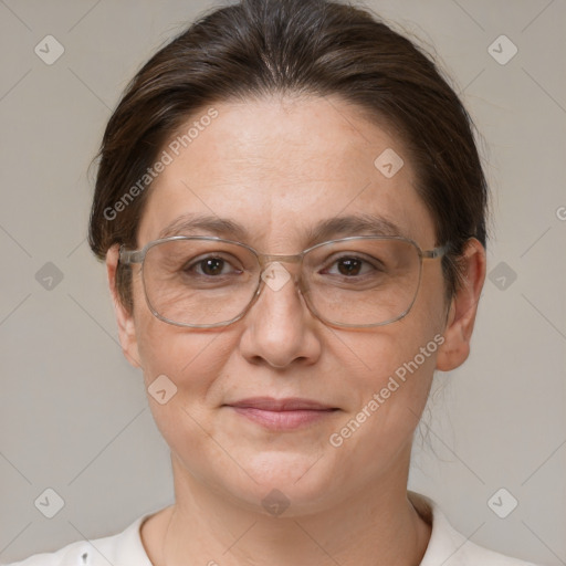 Joyful white adult female with short  brown hair and brown eyes