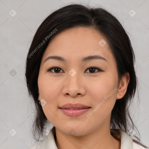 Joyful asian young-adult female with medium  brown hair and brown eyes