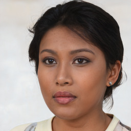 Neutral asian young-adult female with medium  brown hair and brown eyes