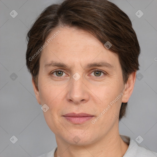 Joyful white adult male with short  brown hair and grey eyes