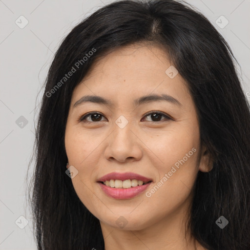 Joyful asian young-adult female with long  brown hair and brown eyes