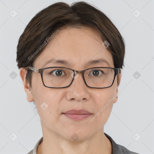 Joyful white adult female with short  brown hair and brown eyes