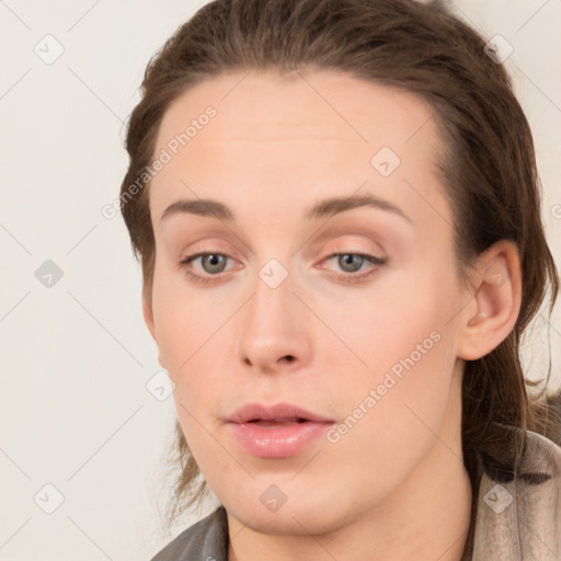 Neutral white young-adult female with long  brown hair and grey eyes