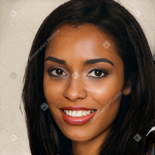 Joyful black young-adult female with long  black hair and brown eyes