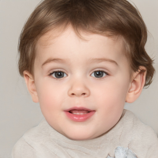 Joyful white child male with medium  brown hair and brown eyes